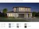 Two-story house with a three-car garage and light-colored stone at 2609 Waterfront Cir, Sarasota, FL 34240