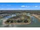 Aerial view of community with lake and homes at 2533 Waterfront Cir, Sarasota, FL 34240