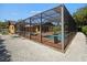 Screened pool area with terracotta tile deck at 2633 Marlette St, Sarasota, FL 34231