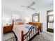 Main bedroom with a queen-sized bed, dresser, and ceiling fan at 4020 Murdock Ave, Sarasota, FL 34231