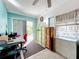 Home office features built-in shelving, desk, and backyard access at 4020 Murdock Ave, Sarasota, FL 34231