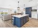 Modern kitchen with island and stainless steel appliances at 2966 Great Abaco Way, Bradenton, FL 34208
