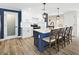 Updated kitchen featuring white cabinets, blue accents, and an island with seating at 2966 Great Abaco Way, Bradenton, FL 34208