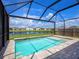 Enclosed pool with lake view at 2966 Great Abaco Way, Bradenton, FL 34208