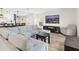 Bright and airy living room with a sectional sofa and wood flooring at 2966 Great Abaco Way, Bradenton, FL 34208