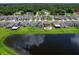 Aerial view of homes with lakefront access and solar panels at 2966 Great Abaco Way, Bradenton, FL 34208