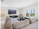 Relaxing living room featuring a sectional sofa and large windows at 2966 Great Abaco Way, Bradenton, FL 34208