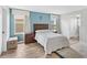 Bedroom with a twin bed, nightstand and a view to the backyard at 2966 Great Abaco Way, Bradenton, FL 34208