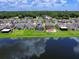 Aerial view of lakefront homes showcasing backyard oasis at 2966 Great Abaco Way, Bradenton, FL 34208