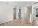 Upstairs hallway with doors to bedrooms and a stairway at 2966 Great Abaco Way, Bradenton, FL 34208