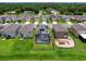 Aerial view of houses with pools and lush landscaping at 2966 Great Abaco Way, Bradenton, FL 34208