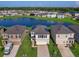 Community overview showcasing houses with lake views and solar panels at 2966 Great Abaco Way, Bradenton, FL 34208