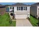 Two-story house with a two-car garage and a well-maintained yard at 2966 Great Abaco Way, Bradenton, FL 34208