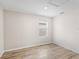 Empty bedroom with hardwood floors and a window at 2966 Great Abaco Way, Bradenton, FL 34208