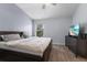Main bedroom with a king-size bed, TV, and ample closet space at 14813 Skip Jack Loop, Lakewood Ranch, FL 34202