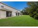 Spacious backyard with grassy area and multiple screened patios at 14813 Skip Jack Loop, Lakewood Ranch, FL 34202