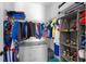 Spacious walk-in closet with shelving and hanging rods at 14813 Skip Jack Loop, Lakewood Ranch, FL 34202