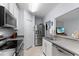 Kitchen with stainless steel appliances and gray countertops at 14813 Skip Jack Loop, Lakewood Ranch, FL 34202
