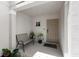 Small front porch with bench and potted plants at 14813 Skip Jack Loop, Lakewood Ranch, FL 34202