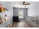 bedroom with crib, dresser and shelving with books at 14813 Skip Jack Loop, Lakewood Ranch, FL 34202