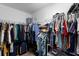 Large walk-in closet with ample hanging and shelving space at 14813 Skip Jack Loop, Lakewood Ranch, FL 34202