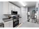 Kitchen with stainless steel appliances and gray countertops at 14813 Skip Jack Loop, Lakewood Ranch, FL 34202
