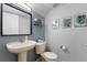 Stylish bathroom with a pedestal sink and modern decor at 14813 Skip Jack Loop, Lakewood Ranch, FL 34202