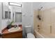 Clean bathroom with a tub, toilet and vanity with a mirror at 14813 Skip Jack Loop, Lakewood Ranch, FL 34202