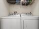 Laundry room with side-by-side Whirlpool washer and dryer at 14813 Skip Jack Loop, Lakewood Ranch, FL 34202