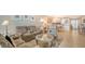 Spacious living room with reclining sofas, coffee table and ocean view at 1045 Gulf Of Mexico Dr # 403, Longboat Key, FL 34228