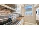 Clean and functional kitchen with stove, microwave, and cabinets at 1045 Gulf Of Mexico Dr # 403, Longboat Key, FL 34228