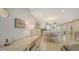 Bright dining area with table and chairs, view into kitchen and living room at 1045 Gulf Of Mexico Dr # 403, Longboat Key, FL 34228
