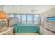 Spacious bedroom with ocean views, large bed, and ample dresser storage at 1045 Gulf Of Mexico Dr # 403, Longboat Key, FL 34228