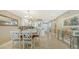 Open dining area with view into living space and kitchen at 1045 Gulf Of Mexico Dr # 403, Longboat Key, FL 34228