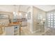 Well-equipped kitchen with granite counters and entryway view at 1045 Gulf Of Mexico Dr # 403, Longboat Key, FL 34228