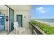Balcony with chair and ocean view,sliding doors lead inside at 1045 Gulf Of Mexico Dr # 403, Longboat Key, FL 34228