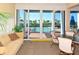 Bright community room with ocean view and comfortable seating at 1045 Gulf Of Mexico Dr # 403, Longboat Key, FL 34228