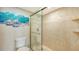 Bathroom with walk-in shower and neutral tile at 1045 Gulf Of Mexico Dr # 403, Longboat Key, FL 34228