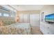 Guest bedroom with queen-size bed and ocean view at 1045 Gulf Of Mexico Dr # 403, Longboat Key, FL 34228