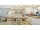 Bright dining area with table and chairs, adjacent to kitchen at 1045 Gulf Of Mexico Dr # 403, Longboat Key, FL 34228