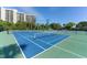Three well-maintained tennis courts at 1045 Gulf Of Mexico Dr # 403, Longboat Key, FL 34228