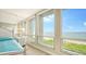 Bedroom with stunning ocean views and a comfortable bed at 1045 Gulf Of Mexico Dr # 403, Longboat Key, FL 34228