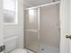 Clean bathroom with a shower stall and toilet at 2318 N Chamberlain Blvd, North Port, FL 34286