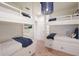 Charming bedroom with built-in bunks, offering ample sleeping space at 102 75Th St, Holmes Beach, FL 34217