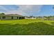 Expansive backyard extending to a serene pond, offering a tranquil outdoor space at 11622 Summit Rock Ct, Parrish, FL 34219