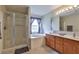 Bright bathroom features a shower, soaking tub, vanity, and ample counter space at 11622 Summit Rock Ct, Parrish, FL 34219