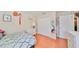 Well-lit bedroom with closet, dresser, decor and comfy bed at 11622 Summit Rock Ct, Parrish, FL 34219