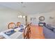 Elegant dining room with hardwood floors featuring a chandelier and an ornate dining table at 11622 Summit Rock Ct, Parrish, FL 34219