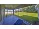 Screened lanai overlooking green lawn with views of the pond and foliage at 11622 Summit Rock Ct, Parrish, FL 34219
