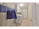 Functional laundry room features a washer, dryer, cabinets, and door at 11622 Summit Rock Ct, Parrish, FL 34219